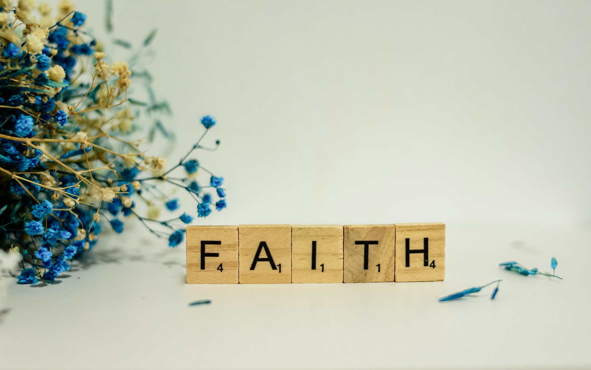 Image of scrabble tiles spelling the word faith
